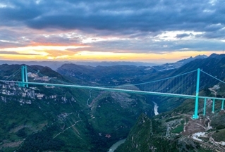 World's highest bridge opens to traffic in China's mountainous southwest